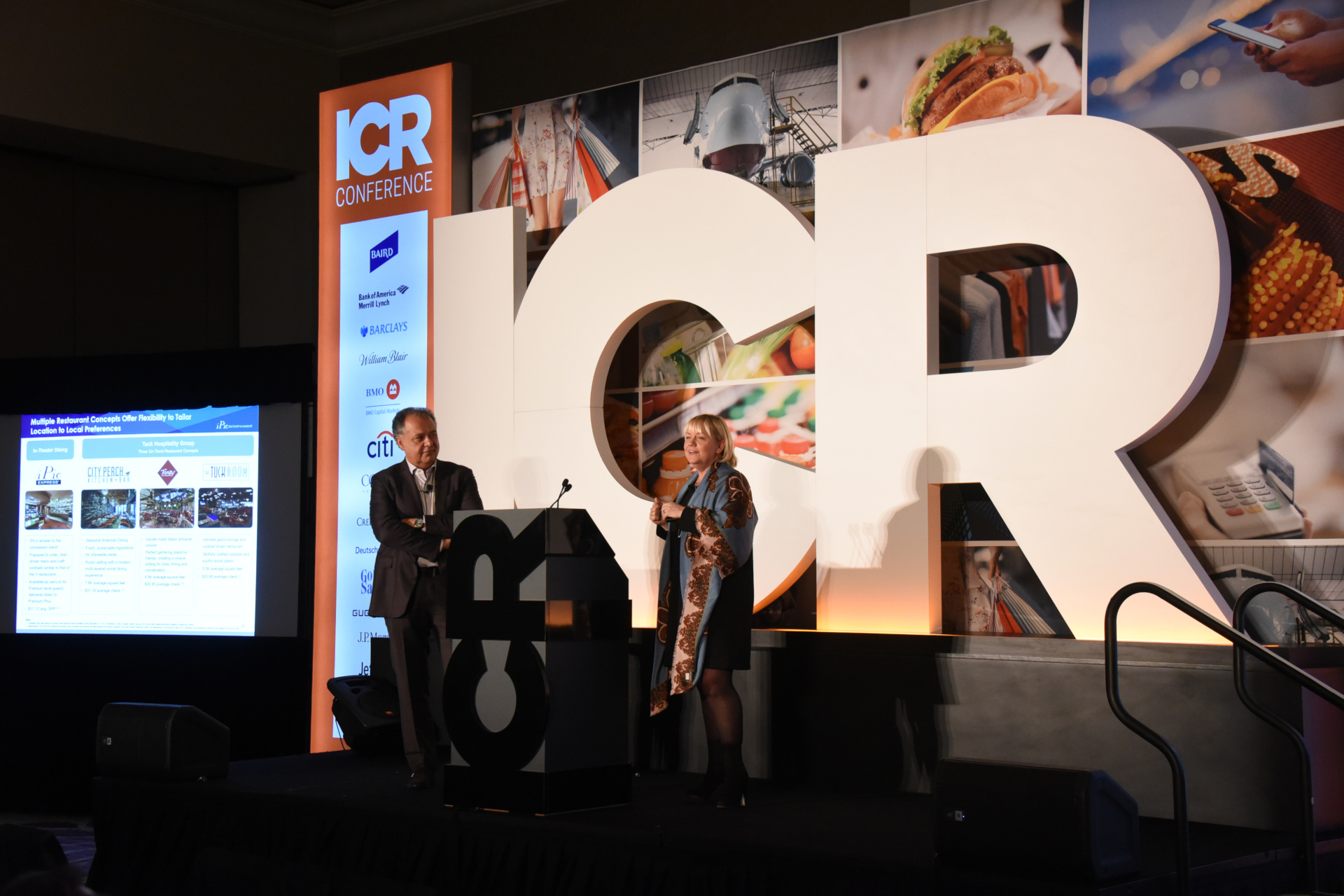 two speakers on stage at the ICR conference