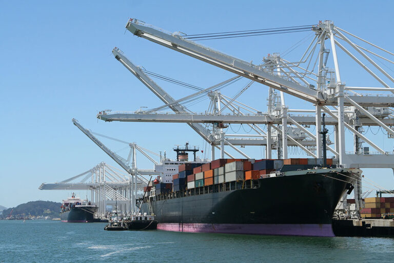 Shipping containers on cargo ship at doc