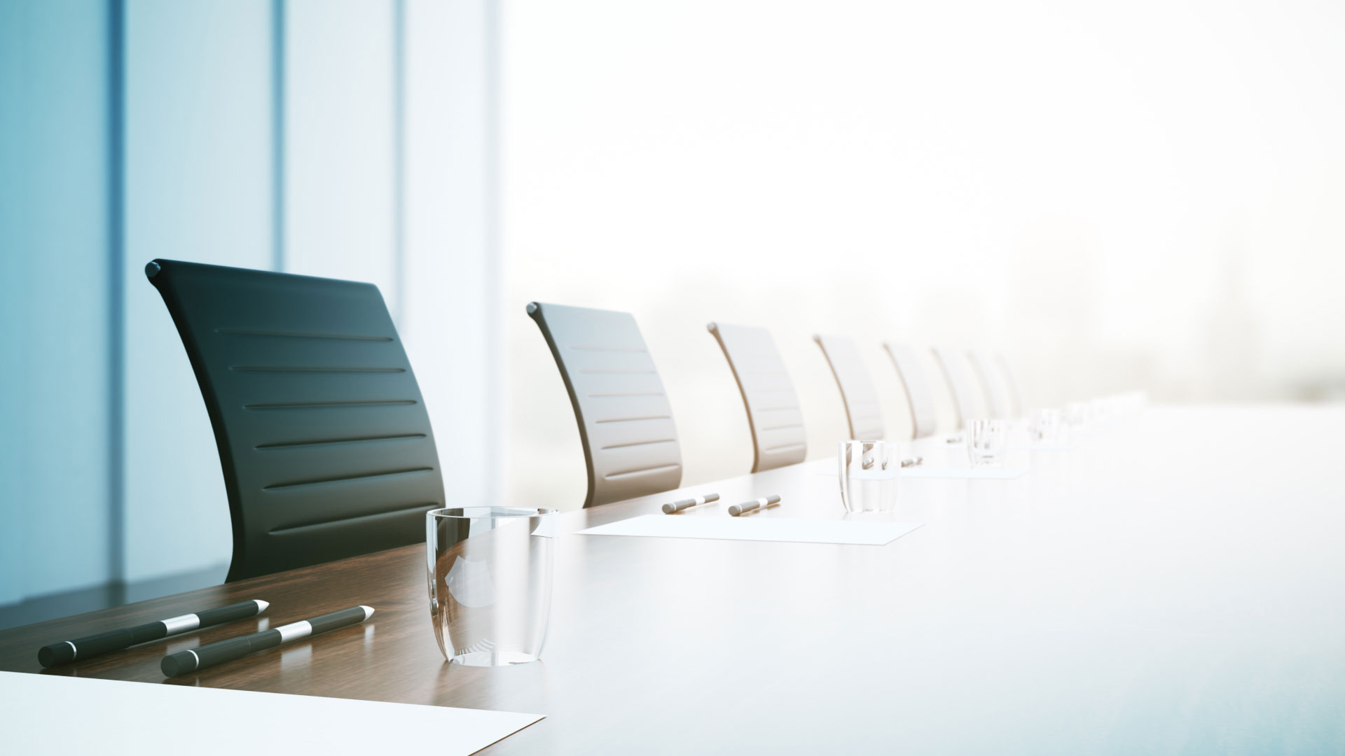 Empty board room with chairs lined up