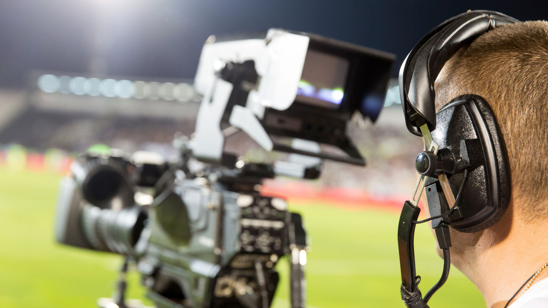 Camera operator filming a sporting event