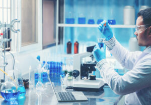 Man using test tubes in lab