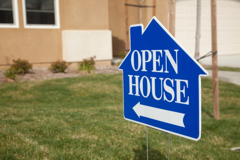 open house sign in front of house on lawn