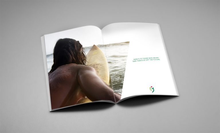 open spread of brochure showing a surfer