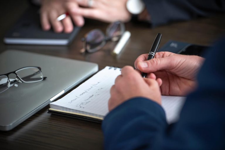 Close up of meeting table between two business men