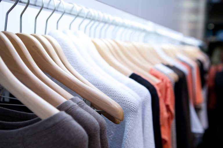 close up image of clothing rack in department store