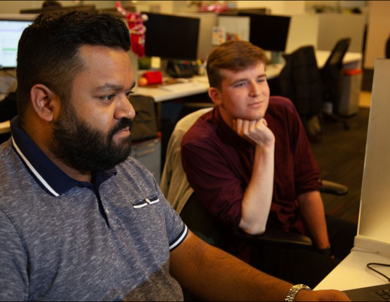 Two ICR colleagues working together in an office setting