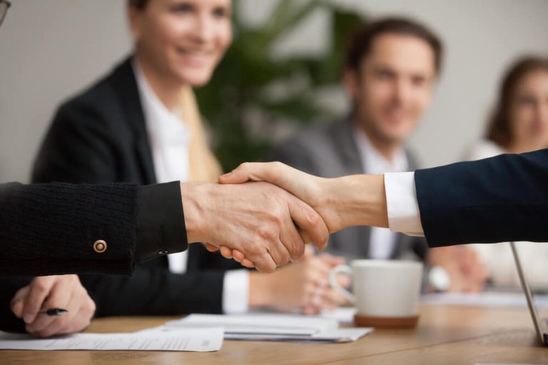 businessmen shaking hands making agreement