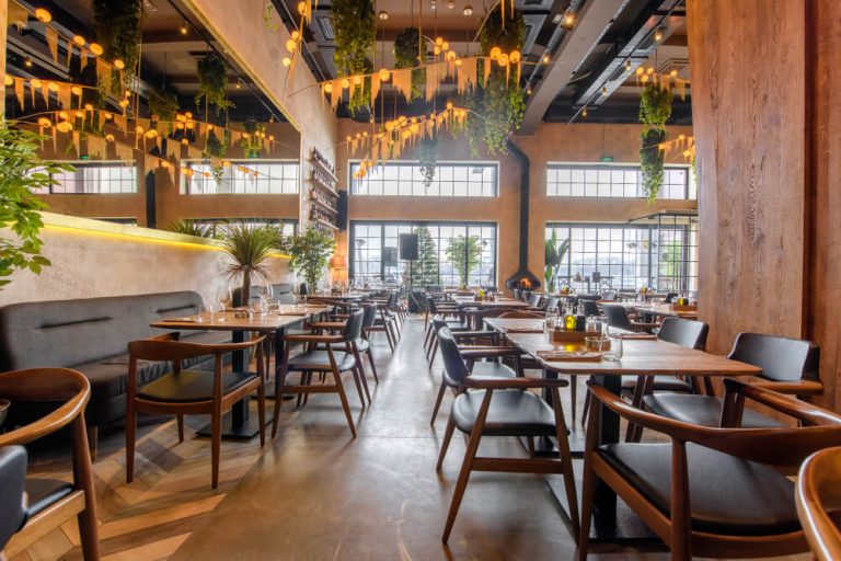 interior of empty restaurant with tables set