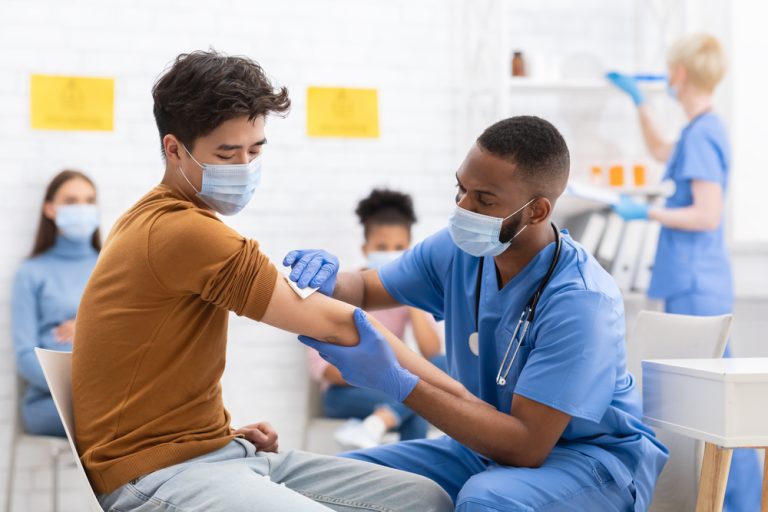 doctor giving patient vaccine