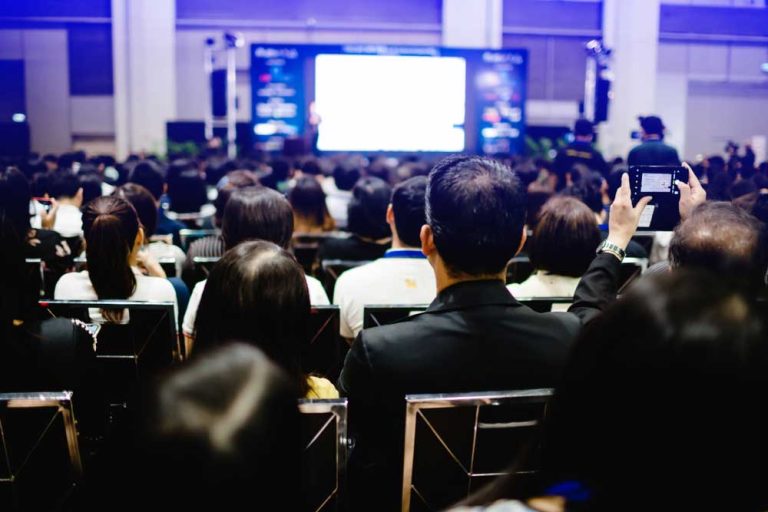 many business people listening on the conference