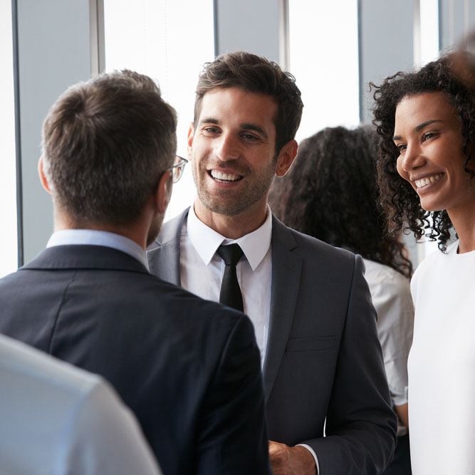 group of businesspeople having an informal office meeting