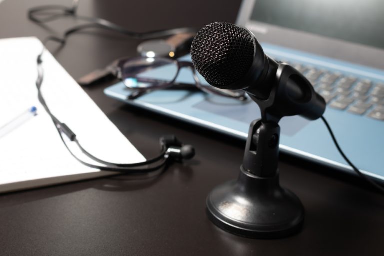 A microphone and laptop ready for remote broadcast interview