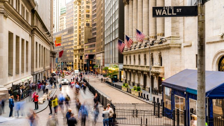 people on wall street in new york city