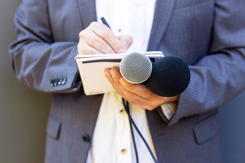 reporter with microphone