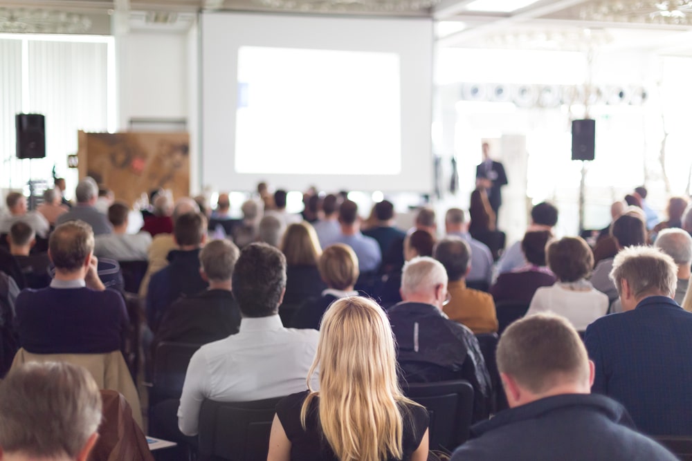 people listening to a conference speaker JP Morgan Healthcare