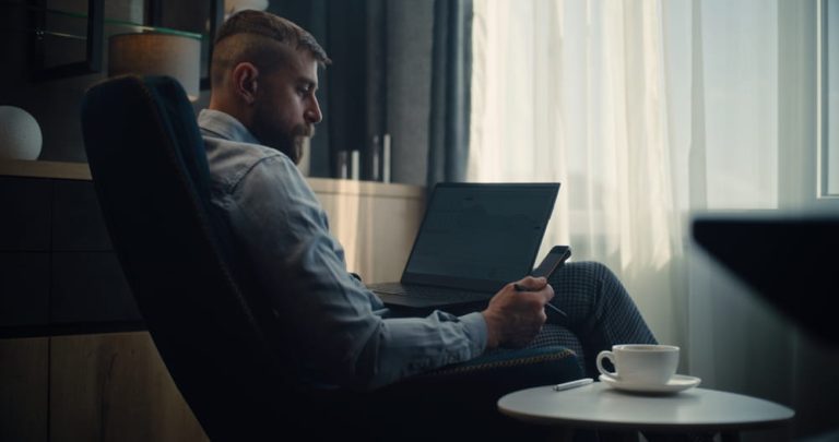 retail investor sitting in chair with computer