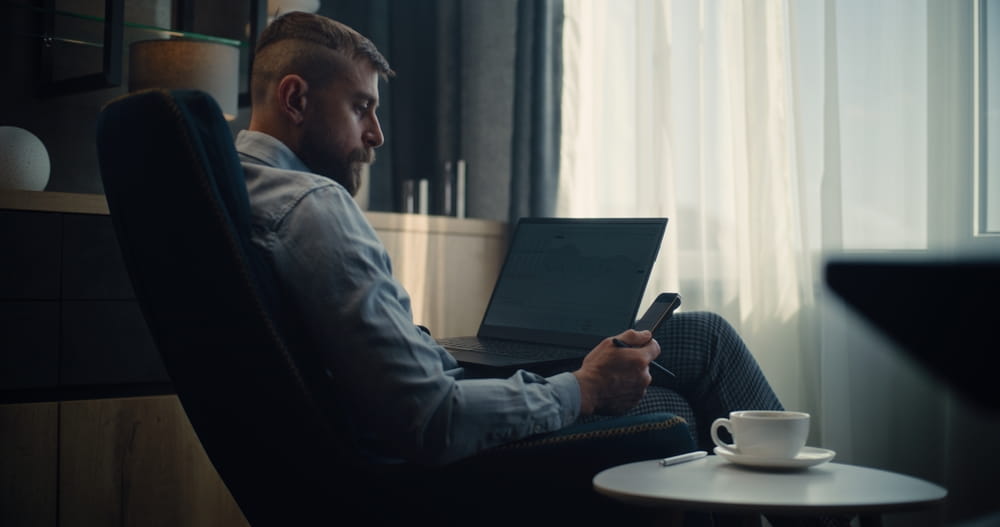 retail investor sitting in chair with computer