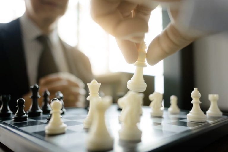 Business people playing chess to represent business special situation