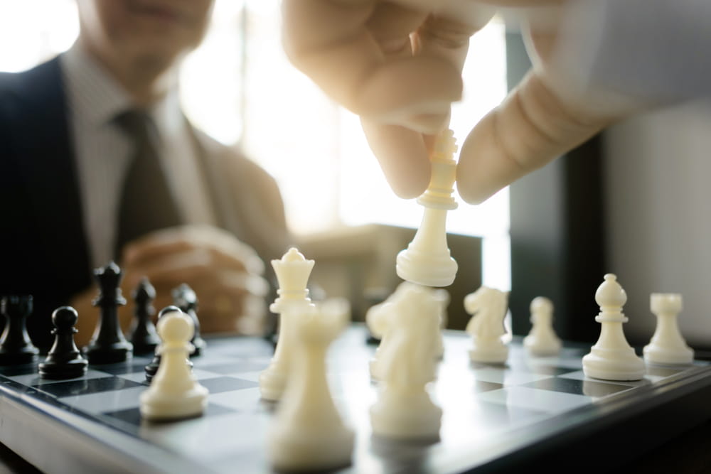 Business people playing chess to represent business special situation